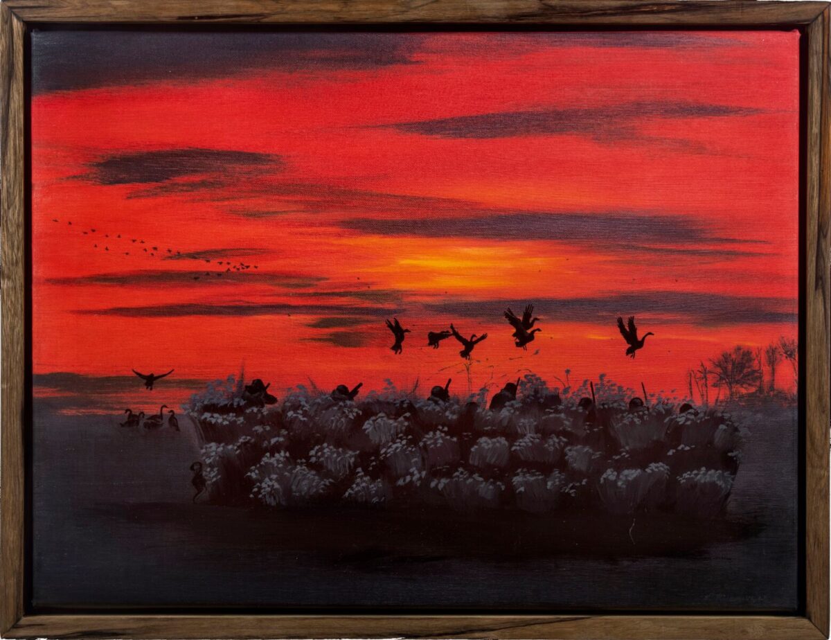 Painting of a red sunset with shadows of birds in the sky and grey foliage in the foreground.